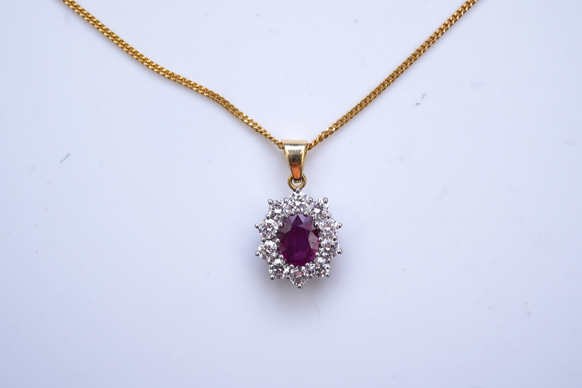 A ruby and diamond pendant